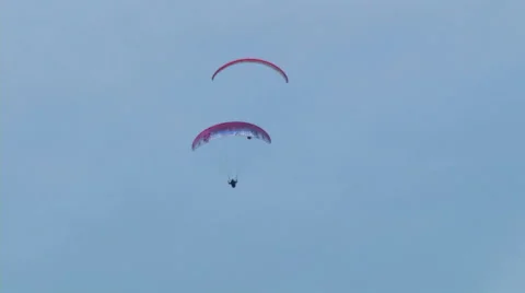 Acrobatic paragliding synchro white red 25 (slow motion) Stock Footage 40279633
