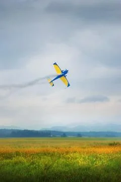 Acrobatic plane flying low Stock Photos