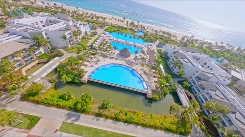 Acrobatic racing fpv drone evolutions at Hard Rock holiday resort at Punta Stock Footage 157301233