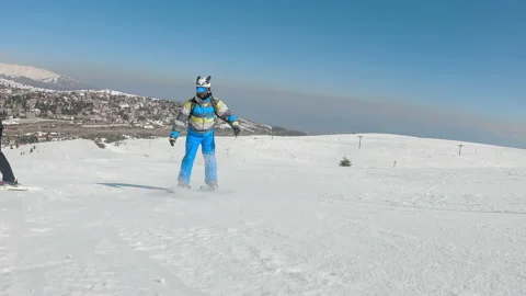 Acrobatic skier doing tricks skiing on groomed slope, slow motion 動画素材 219357602