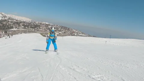 Acrobatic skier doing tricks skiing on groomed slope, slow motion 動画素材 220885906