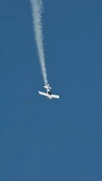 Acrobatic white propeller plane Stock Photos