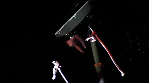 Acrobats fly above the earth Stock Footage 62196324