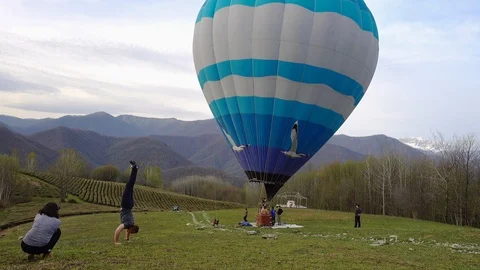 Acrobotic trick in the mountains Stock Footage 109466937