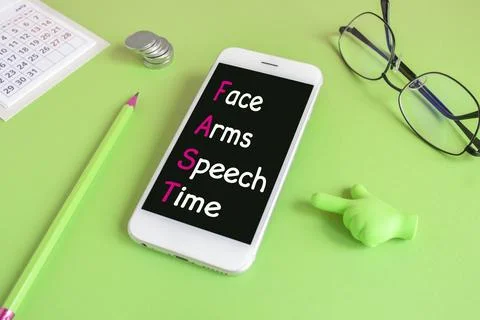 The acronym FAST on phone screen. Stock Photos