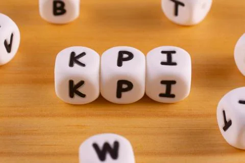 The acronym KPI or key performance indicator is made up of white plastic bloc Stock Photos