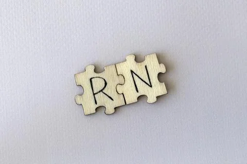 The acronym RN, which stands for Right Now. The letters written on the puzzles. Stock Photos