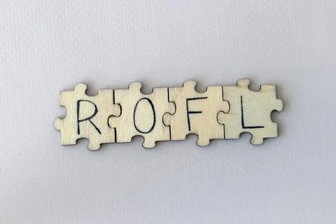 The acronym ROFL, which stands for Rolling On the Floor Laughing. The letters Stock Photos
