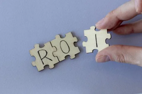 The acronym ROI, which stands for Return On Investment. The letters written on Stock Photos