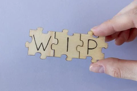 The acronym WIP, which stands for Work In Progress. The letters written on the Stock Photos