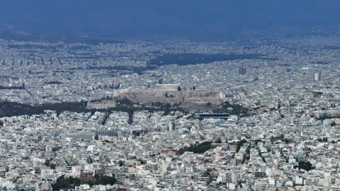 Acropolis and Parthenon amid vast urban cityscape in Athens Greece Stock Footage 345372173