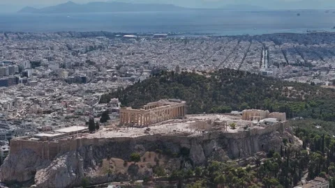 Acropolis of Athens with Parthenon hill overlooking city grid and Saronic Gulf Stock Footage 345372105