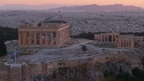 Acropolis Drone Orbit with Flag at Half Mast During Sunset Stock Footage 325826670