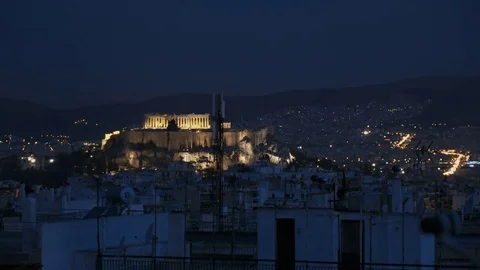 Acropolis hill at night as seen through Athenian rooftops Stock Footage 75045632