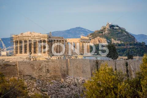 Acropolis in rays of sunset Stock Photos