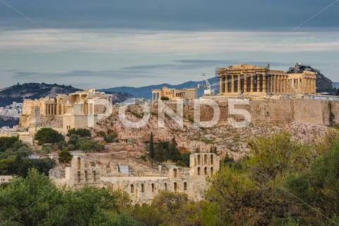 Acropolis in rays of sunset Stock Photos