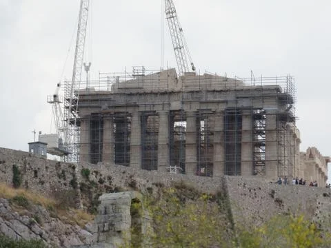 The Acropolis is surrounded by construction machines. Stock Photos