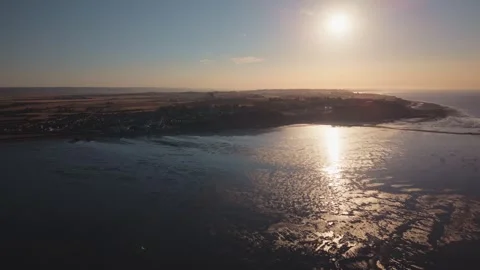 Across Seaside Coastline at Solar Eclipse beginning, wide aerial view Stock Footage 345864059