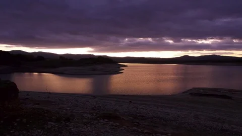 Across the sunset in the lake - time lapse 4K Stock Footage 83626719