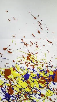 Acrylic gouache solid color stains on white background splashing drops Stock Photos