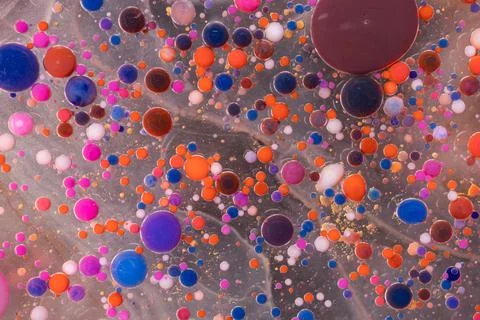 Acrylic paint balls abstract texture. Bright colors fluid, flowing wallpaper Stock Photos