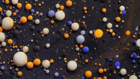 Acrylic paint bubbles spreading on black silver surface mix abstract design Stock Footage 128766112