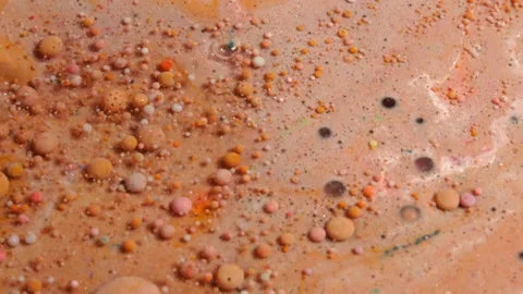 Acrylic paint macro. Abstract art Orange Red colors bubbles Stock-Footage 150630247