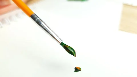Acrylic paints and brush. Close-up of a brush in paint, the artistic process. Stock Footage 311127341
