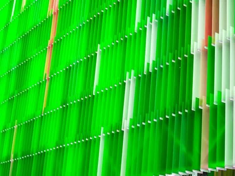 Acrylic plastic sheet interior a few white and color apple green moss 库存照片