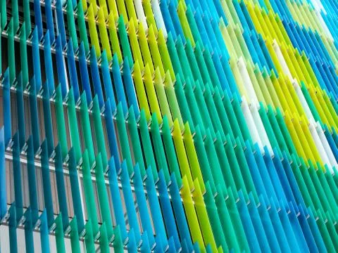 Acrylic plastic sheet interior, text A design on 80 degree, blue aqua yellow 库存照片