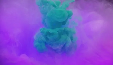 Acryllic color dissolving in water Stock Photos