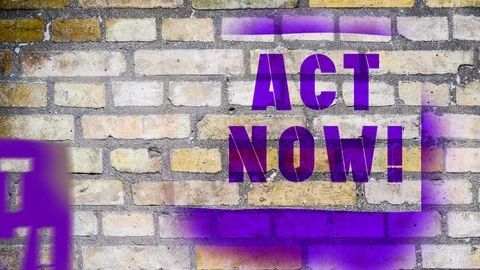 Act Now! - graffiti stencil Stock Footage 121131591