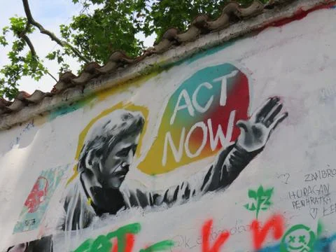 'ACT NOW' Grafitti Stock Photos