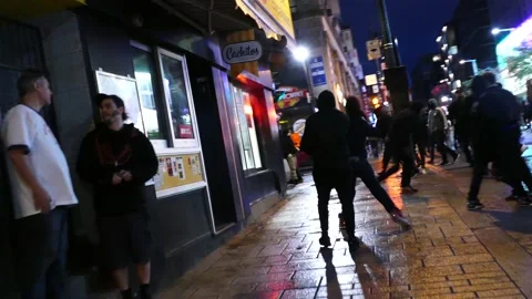 Act of violence caught on tape at small business on street front ground level Stock Footage 137552847
