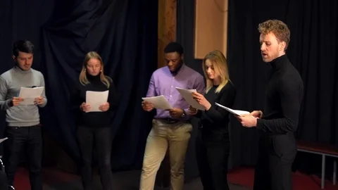 Acting school developing a script with papers Stock Footage 125406417