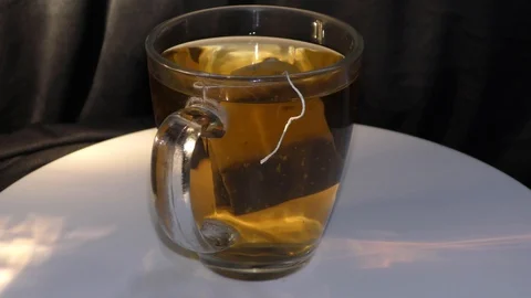 Action and motion with dipping tea bag in the cup Stock Footage 111274936