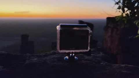 Action camera in a case recording a scenic sunset on a mountain. Stock Footage 313240928