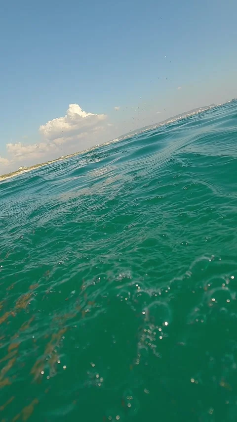 Action camera dives into water waves of summer sea shoot man on paddleboard. Sup Stock Footage 333243231