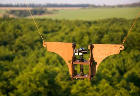 The action camera is fixed in the air on a special mount for shooting video Stock Photos