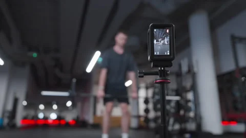 Action Camera in Focus With Man Performing Romanian Deadlift Stock Footage 346789454