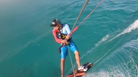 Action camera footage of a kite surfer gliding on blue water in the sea, Egypt Stock Footage 119764075