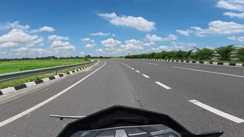 Action camera footage  of motorcycle driving over a asphalt national highway Video stock 284053625