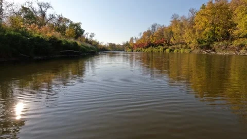 Action camera from front of canoe while paddling along a calm river in the autum Stock Footage 301109465