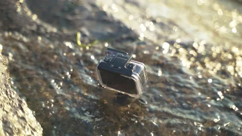 Action camera getting splashed Stock Footage 134958989