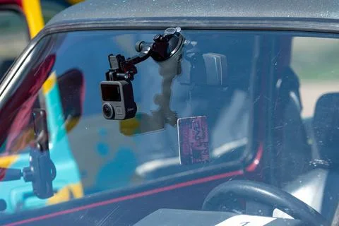 Action camera GoPro Max for video recording mouonted on the car front window Stock-Fotos