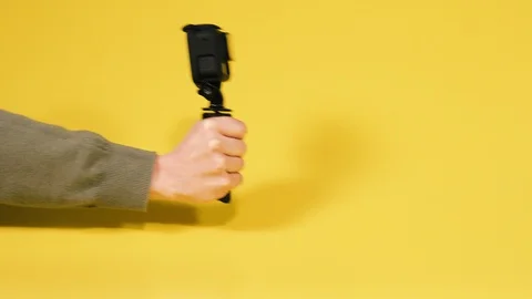 Action camera. A hand holds an action video camera. Stock Footage 129409497