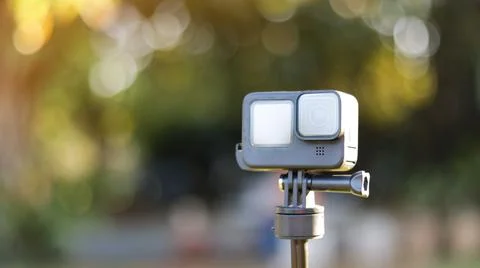 Action camera on its handle on blur background Stock Photos
