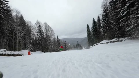 Action camera low angle view of skis of skier going downhill on alpine ski Stock Footage 199822349