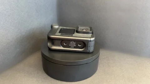 Action camera with multimedia case rotating in studio Stock Footage 330894327