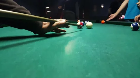 Action camera over eight ball pool table follow hand of a player missing a shot Stock Footage 58952446
